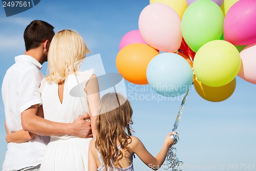 Image of family with colorful balloons