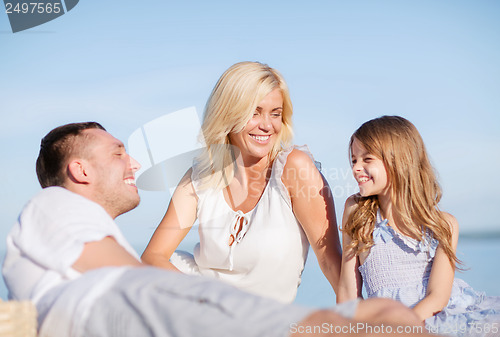 Image of happy family having a picnic
