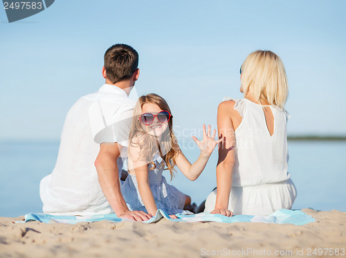 Image of happy family on the beach
