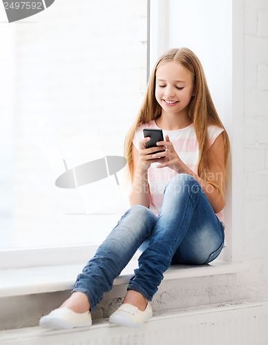 Image of girl with smartphone at school