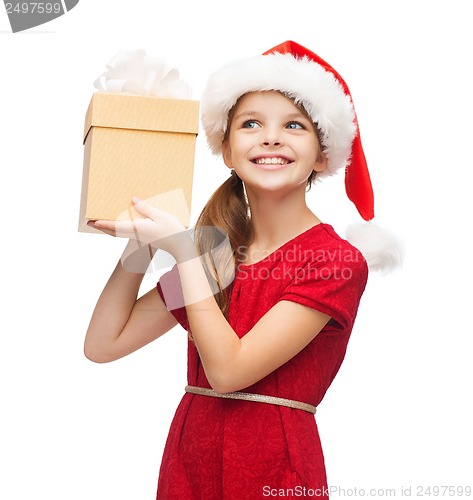 Image of smiling girl in santa helper hat with gift box