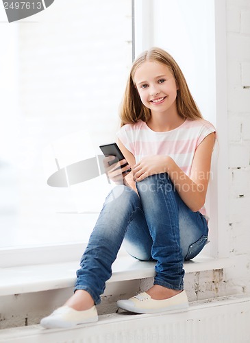 Image of girl with smartphone at school