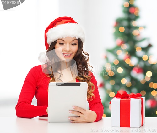 Image of woman with gift box and tablet pc computer