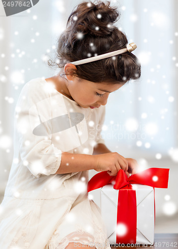 Image of happy child girl with gift box