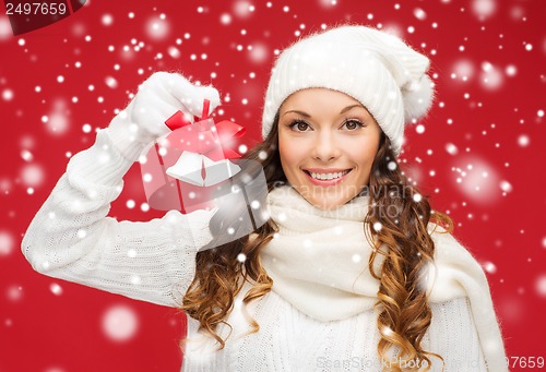 Image of smiling woman in mittens and hat with jingle bells