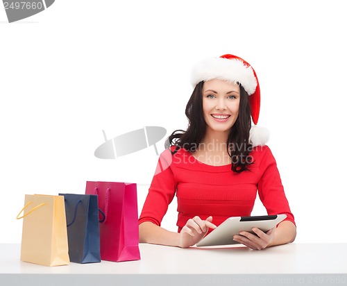 Image of woman with gift box and tablet pc computer
