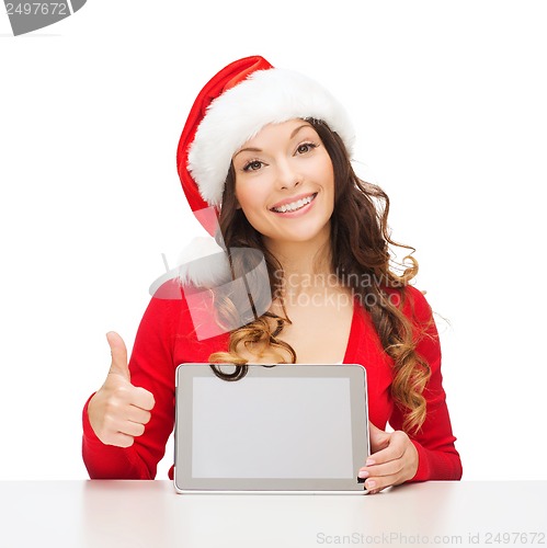 Image of woman in santa helper hat with tablet pc