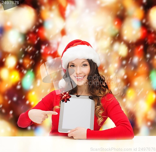 Image of woman in santa helper hat with tablet pc