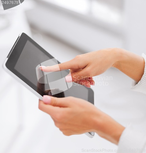 Image of businesswoman with tablet pc in office