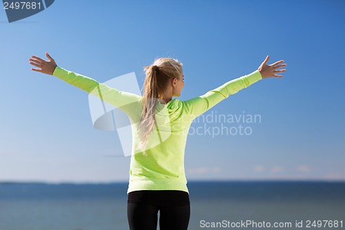 Image of woman doing sports outdoors