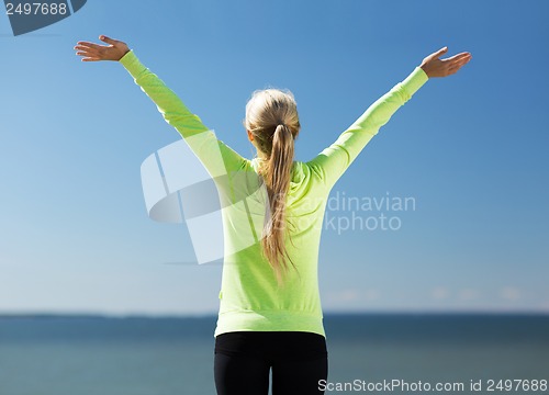 Image of woman doing sports outdoors