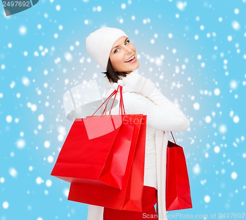 Image of picture of happy woman with shopping bags