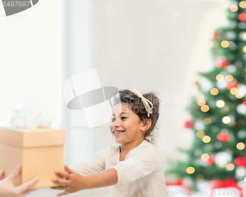 Image of happy child girl with gift box