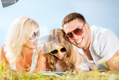 Image of happy family with tablet pc