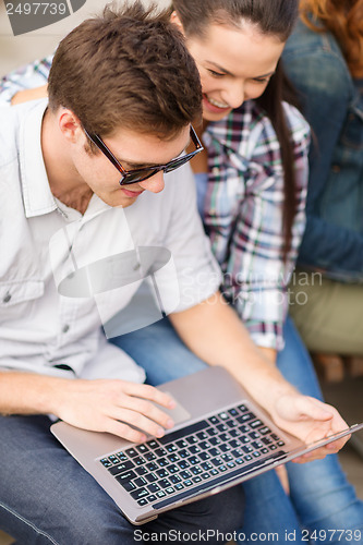 Image of students or teenagers with laptop computer