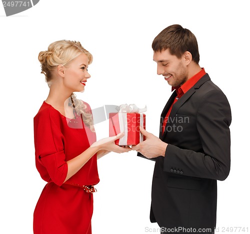 Image of smiling woman and man with gift box