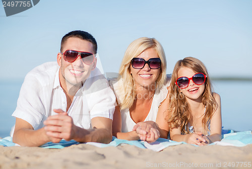 Image of happy family on the beach