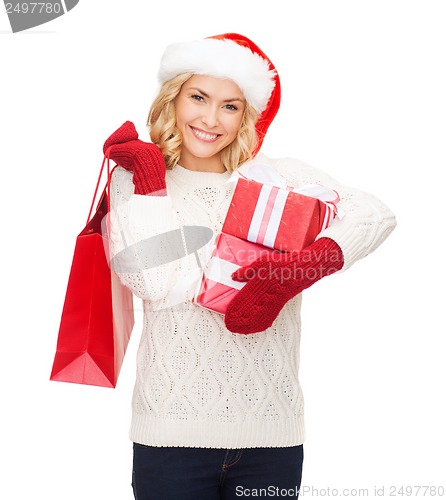 Image of woman in santa helper hat with shopping bags