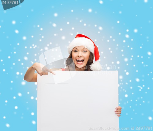 Image of woman in santa helper hat with blank white board