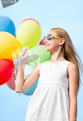 Image of happy girl with colorful balloons