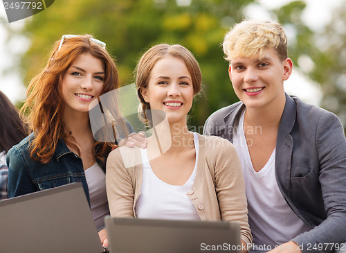 Image of students or teenagers with laptop computers