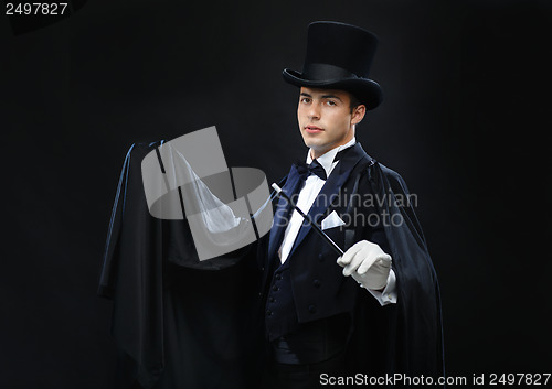 Image of magician in top hat with magic wand showing trick