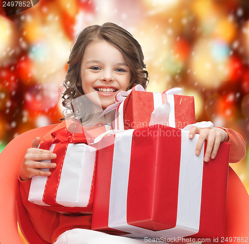 Image of happy child girl with gift boxes