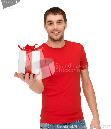 Image of smiling man in red shirt with gift box