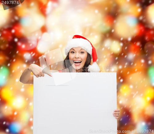 Image of woman in santa helper hat with blank white board