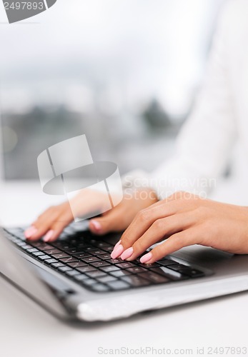 Image of businesswoman using her laptop computer