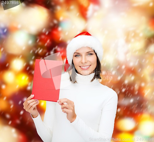 Image of woman in santa helper hat with blank red card