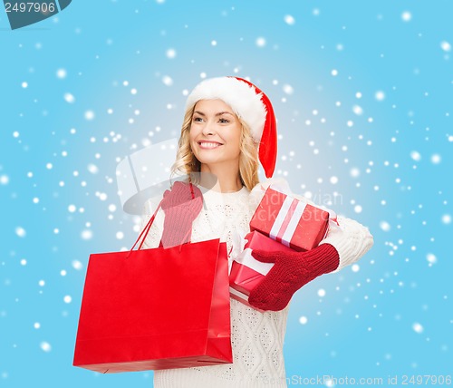 Image of woman in santa helper hat with shopping bags