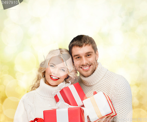 Image of smiling woman and man with gift box