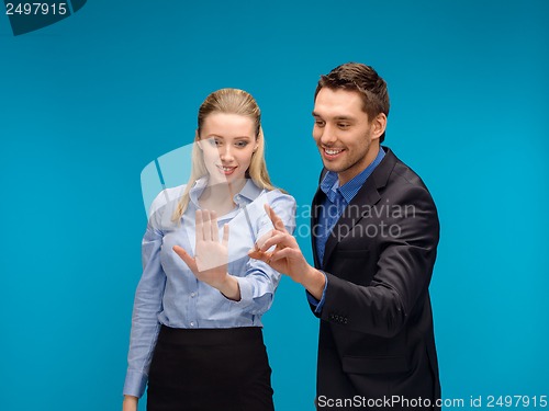 Image of woman and man working with virtual screen