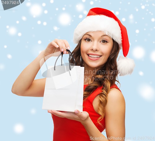 Image of woman in red dress with shopping bag