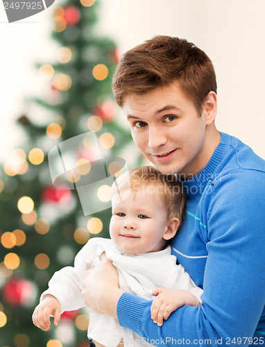 Image of happy father with adorable baby