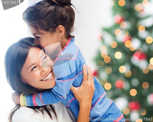 Image of hugging mother and daughter