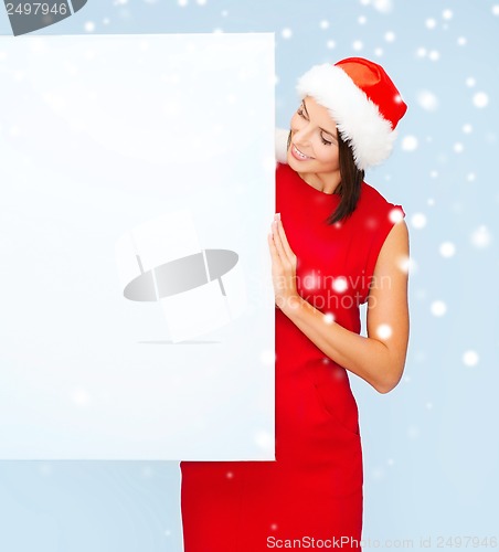 Image of woman in santa helper hat with blank white board