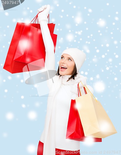 Image of picture of happy woman with shopping bags
