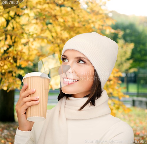 Image of woman in hat with takeaway tea or coffee cup