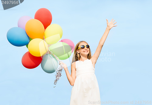 Image of happy girl with colorful balloons