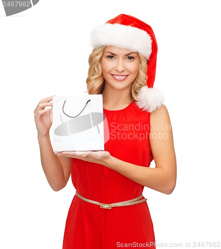 Image of woman in red dress with shopping bag