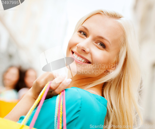 Image of woman with shopping bags in ctiy