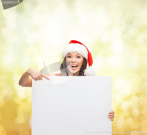 Image of woman in santa helper hat with blank white board