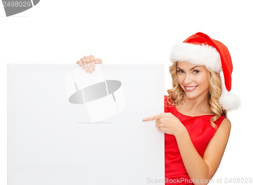 Image of woman in santa helper hat with blank white board