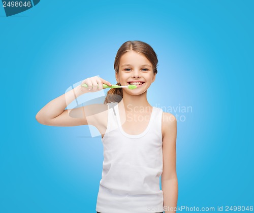 Image of girl in blank white shirt brushing her teeth