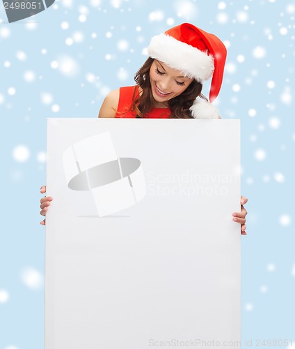Image of woman in santa helper hat with blank white board