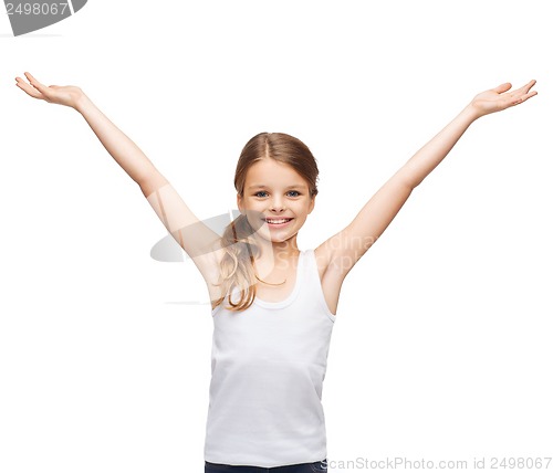 Image of smiling teenage girl with raised hands
