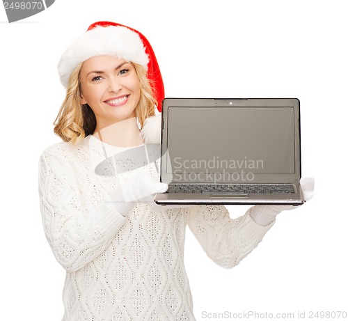 Image of woman in santa helper hat with laptop computer