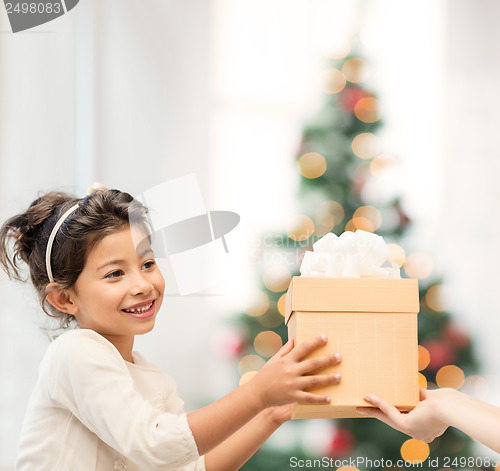 Image of happy child girl with gift box